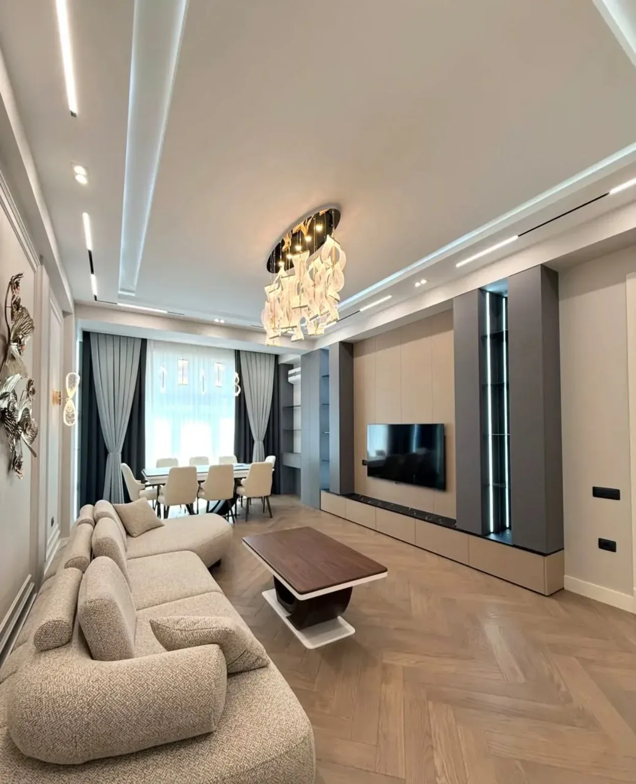 Luxury living room furnished with contemporary seating, coffee table and dining furniture